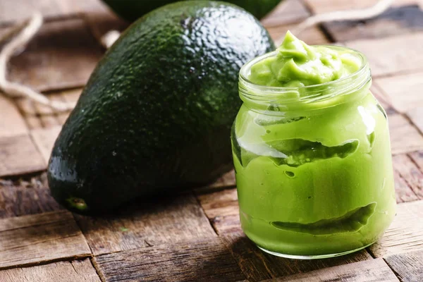 Avocado smoothie in a glass jar — Stock Photo, Image