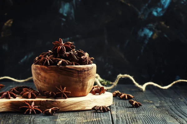 Anise stars in a wooden bowl — Stock Photo, Image