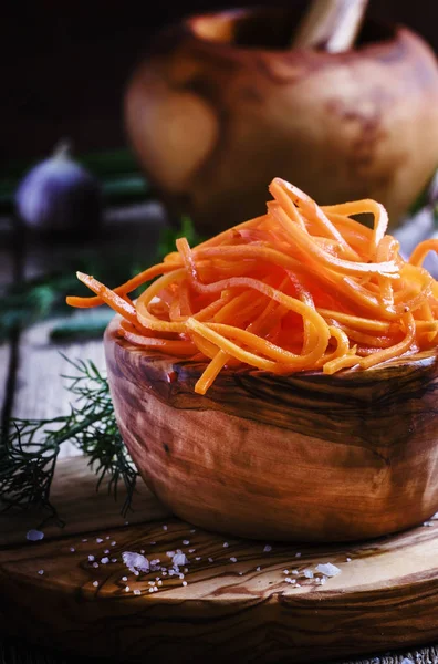 Marinated carrots in a wooden bowl — Stock Photo, Image