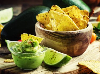 Spicy sauce with avocado and corn chips clipart