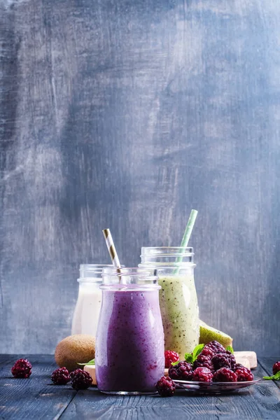 Berry smoothies in bottles — Stock Photo, Image