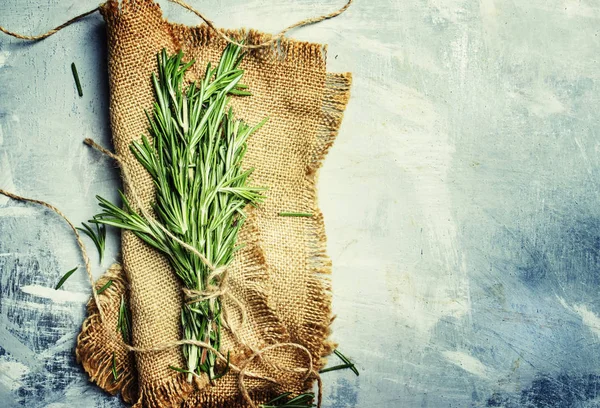 Fresh rosemary in a bundle on a canvas napkin — Stock Photo, Image