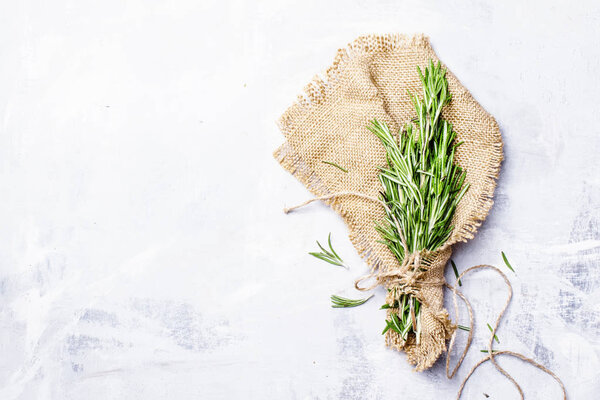 Fresh rosemary in a bundle on a canvas napkin