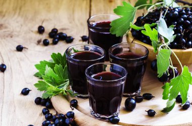 Black currant juice in glasses clipart