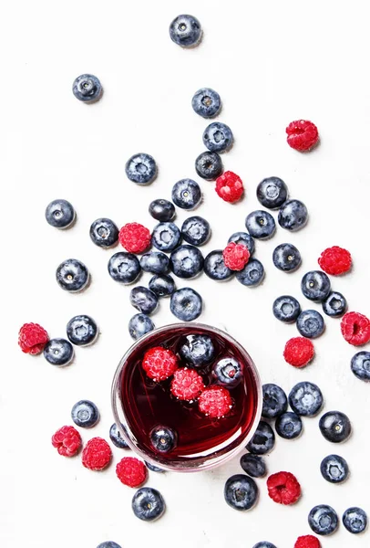 Red berry juice with blueberries and raspberries