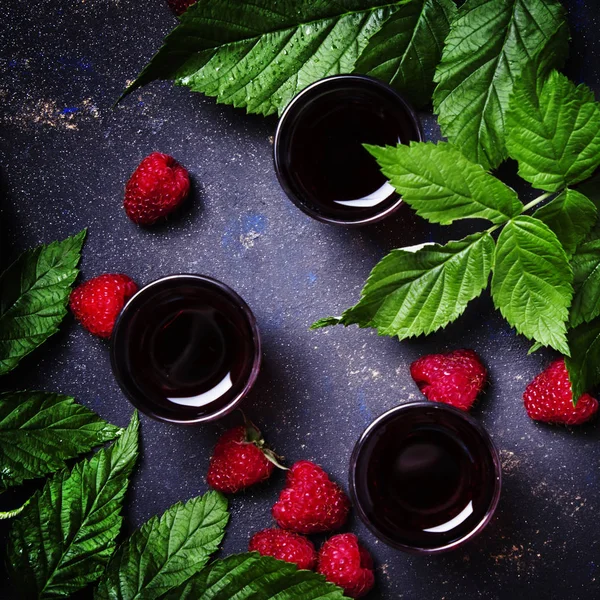 Raspberry drink, black background