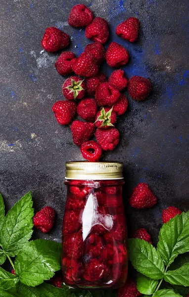 Raspberry compote in a glass bottle — Stock Photo, Image