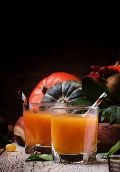 Pumpkin juice on vintage wooden background — Stock Photo, Image