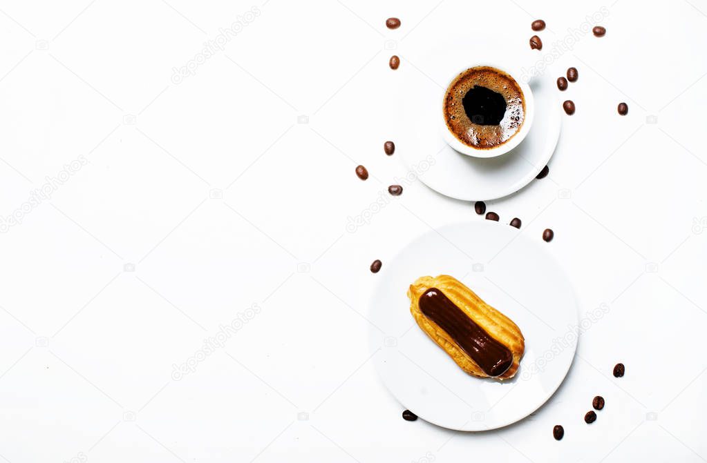 Morning coffee with eclair cake, white background, top view