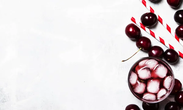 Cold cherry juice with ice, top view