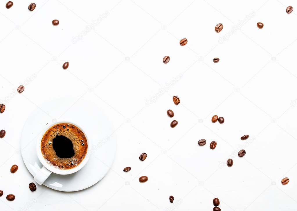 White cup of black coffee espresso with foam, white background, top views