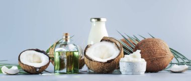 MCT Coconut butter or coconut oil. Organic healthy food, beauty and SPA concept. Blue banner background. Copy space