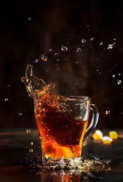 Splash Glass Cup Black Tea Natural Steam Brown Background — 스톡 사진