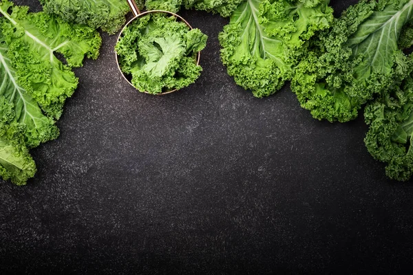Kale cabbage. Green vegetable leaves, top view on black background, healthy eating, vegetarian food — Stock Image Kale Cabbage Green Vegetable Leaves Top View Black Background Healthy Stock Image