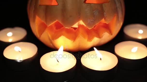 Pumpkin Jack, burning candles. Halloween and All Saints Day. — Stock Video