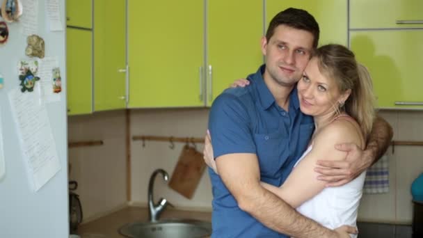 Happy young couple in the kitchen. Young family at home. — Stock Video