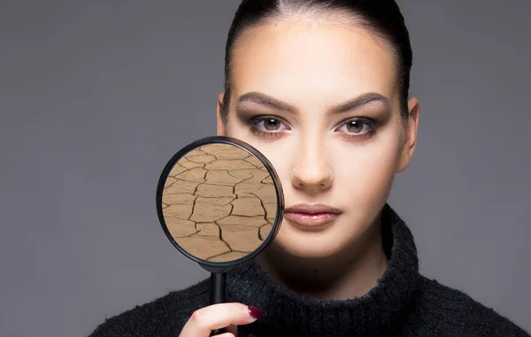 Girl with magnifier beauty skin concept — Stock Photo, Image