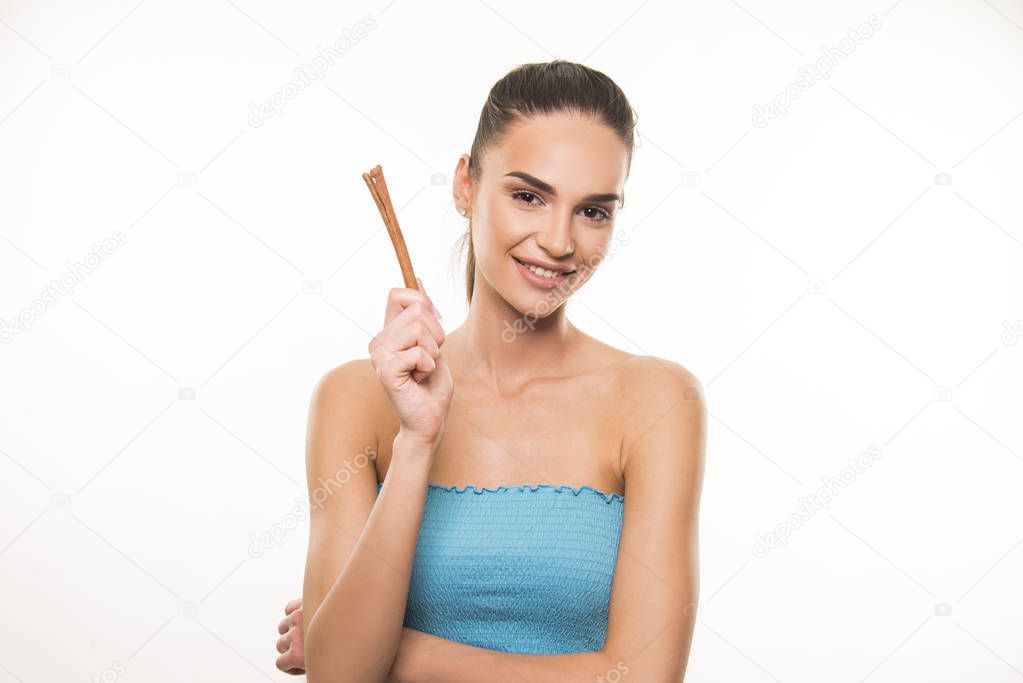 beautiful girl with cinnamon stick 