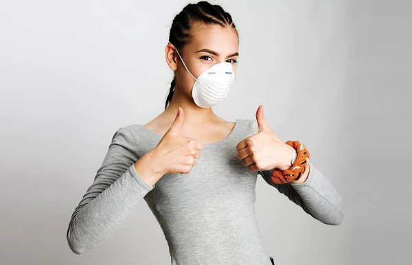 beautiful girl with anti dust protecting mask over her mouth and nose