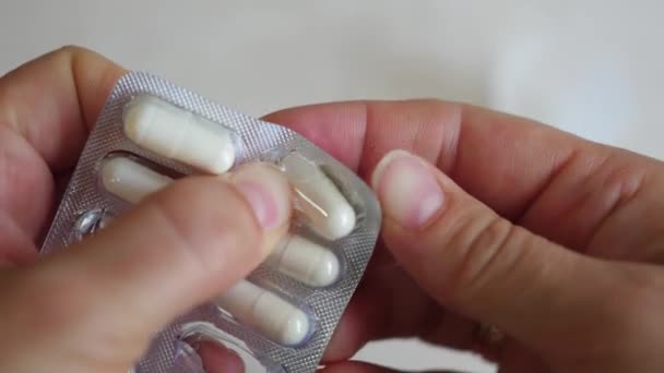 Girl gets a medical cure from its packaging — Stock Video