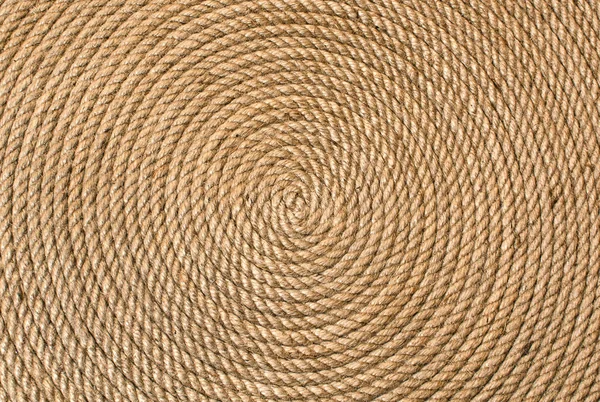 Bakgrund av vridna i en cirkel hampa rep — Stockfoto