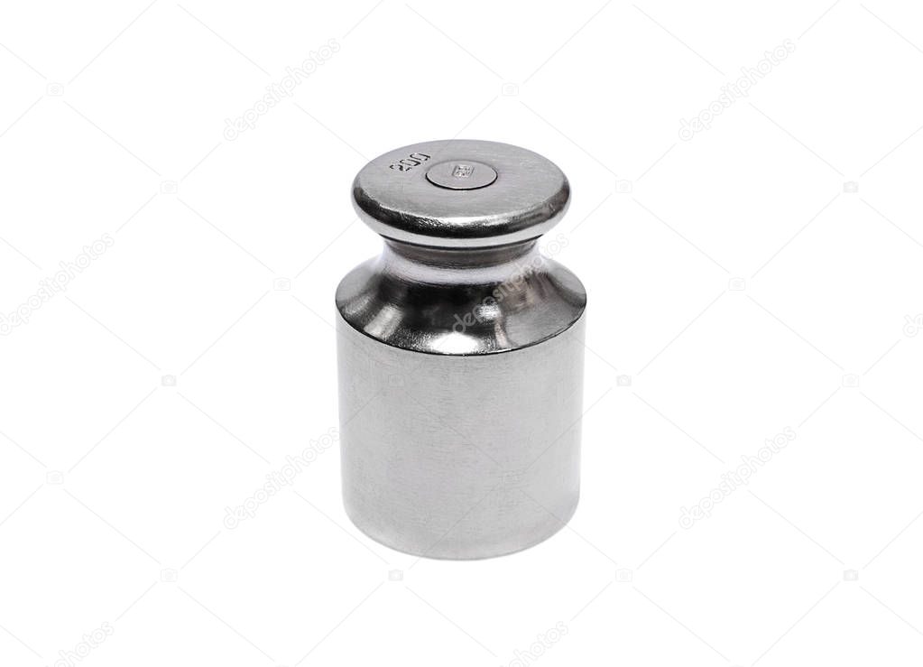 Metal weight for scales on white background closeup