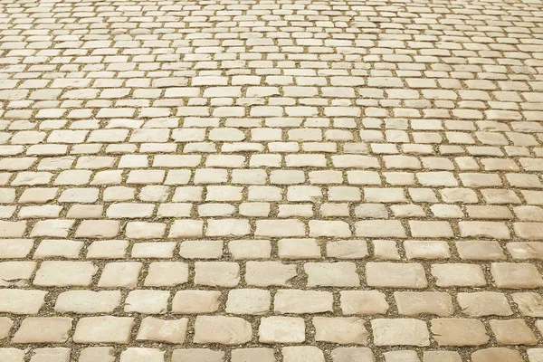 Beige granite mosaic pavement background — Stock Photo, Image