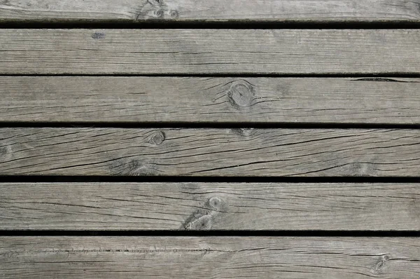 Vecchio grigio scuro recinzione in legno sfondo texture — Foto Stock