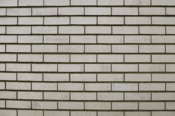 Alte graue Backsteinmauer Hintergrund — Stockfoto