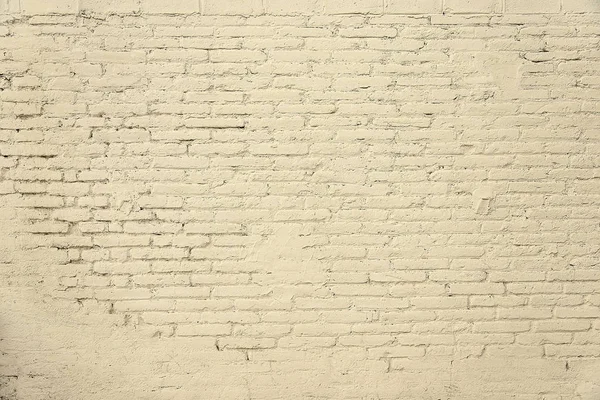 Vecchio muro di mattoni con vernice beige sfondo texture — Foto Stock