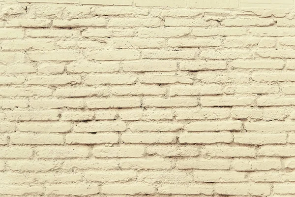 Oude bakstenen muur met beige verf achtergrond textuur — Stockfoto