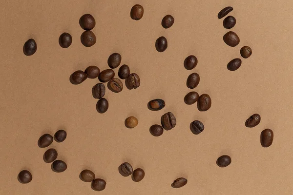 Dry Coffee Beans Light Brown Paper Background Flat Lay Studio — Stock Photo, Image