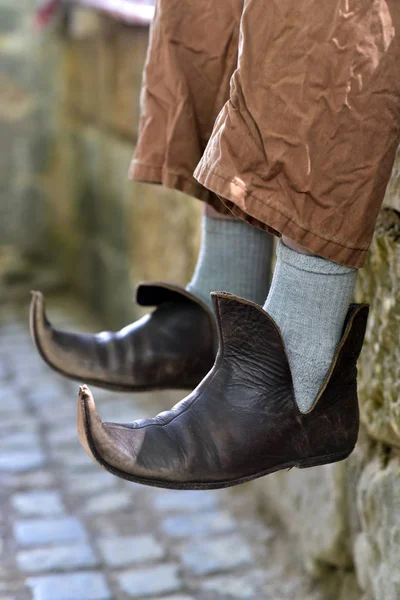 Close up view of a pair of pointy medieval shoes