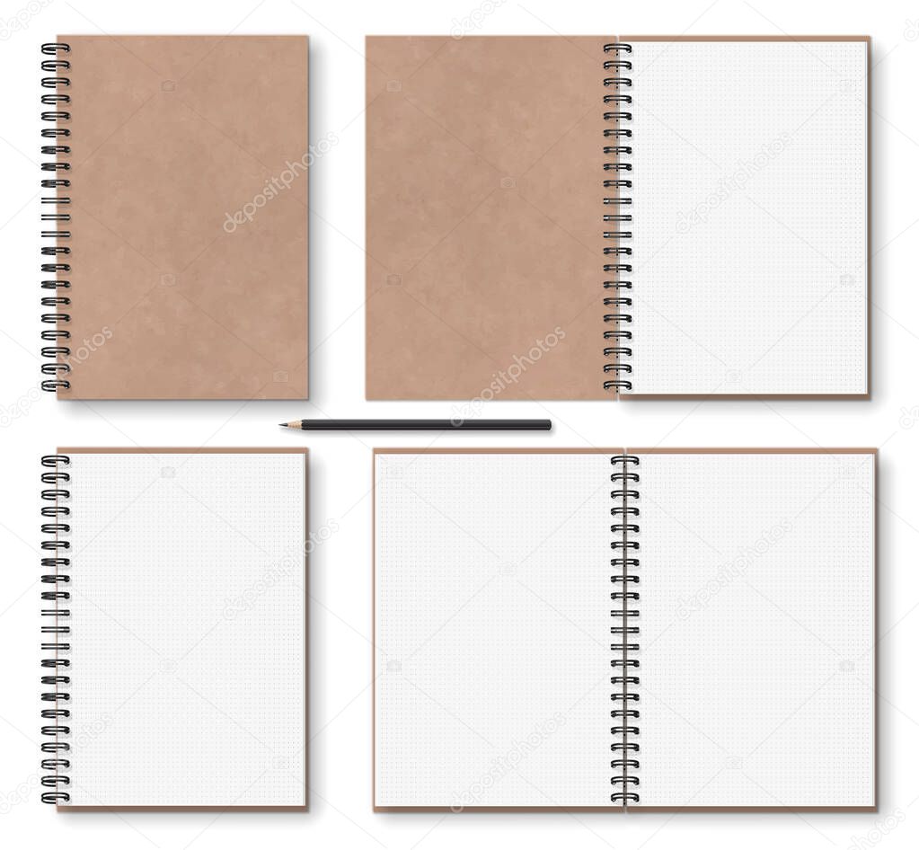 brown paper notebook with black metal spiral on left and wooden 