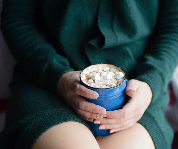 Woman holding blue cup with cocoa and marshmallow — Stock Photo, Image