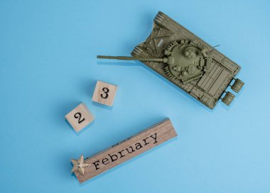 23 Şubat Tatil geçmişi. gebelik Uluslararası Erkekler Günü ve Anavatan Savunma Günü 23 Şubat 'ta tebrik kartı. en üstteki görünüm
