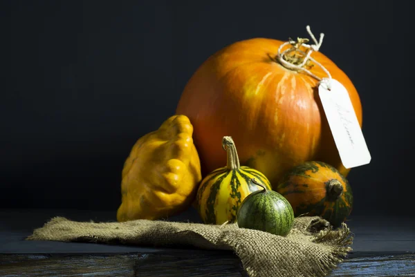 Pumpkins on a blue wooden table. — Stock Photo, Image