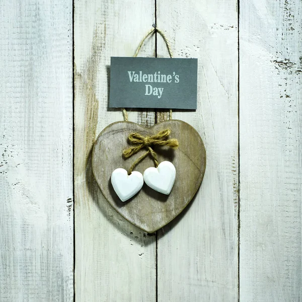 Valentine's Day card with hearts on old wooden background — Stock Photo, Image