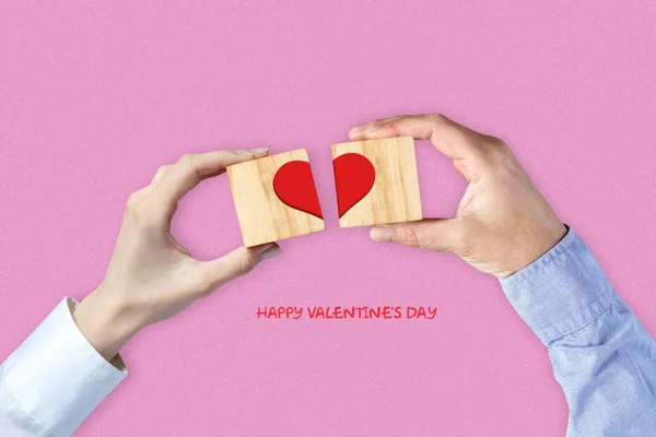 Women and Men hands make up a heart on wooden blocks. Happy Valentine's day background. — 스톡 사진