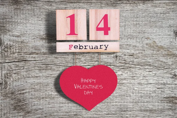 14 de febrero. Calendario de madera sobre fondo de madera. Fondo día de San Valentín —  Fotos de Stock