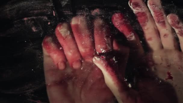 Bloody hand on dirty window glass deep dark background — Stock video