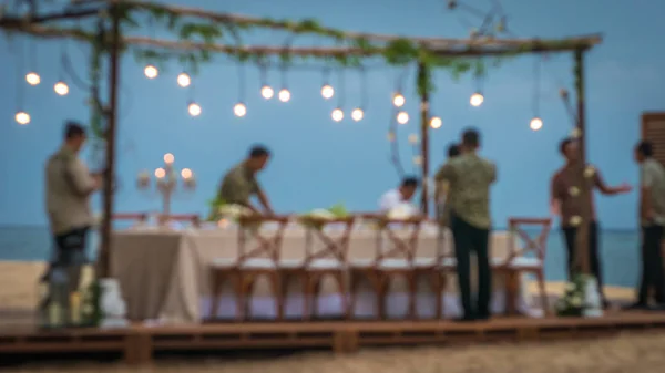Blurred of Table in the Restaurant witch candles and servants on the Beach, Bali — Stock Photo, Image