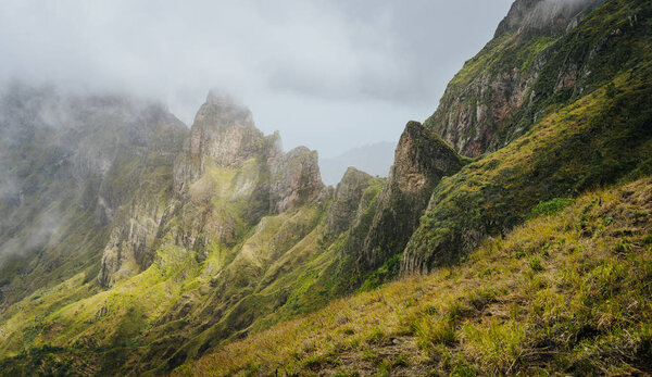 Panorama of a rugged mountain radge overgrown with verdant grass. Xo-Xo Valley. Santo Antao Island, Cape Verde Cabo Verde