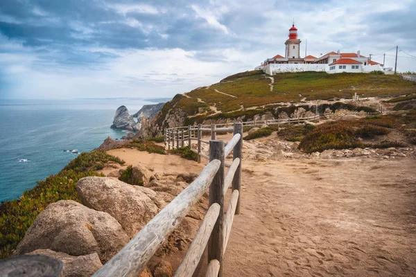 Sintra Portugal. Cape Roca and red lighthouse. Cabo da Roca. Travel and tourism landmark with beautiful coastline cliffs of atlantic ocean — 스톡 사진