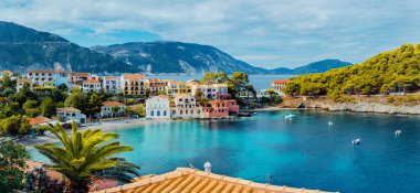 Scenic panoramic view of Assos village on summer morning, Kefalonia island. Summer luxury tourism vacation trip Greece.