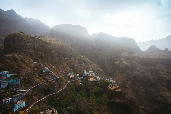 Fontaihas settlement village with Houses nestle into the bluff ridge wall on rocky coast of Santo Antao island — Stock Photo, Image