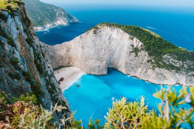 Navagio beach or Shipwreck bay. Turquoise water and pebble white beach in morning light. Famous landmark of Zakynthos island, Greece clipart