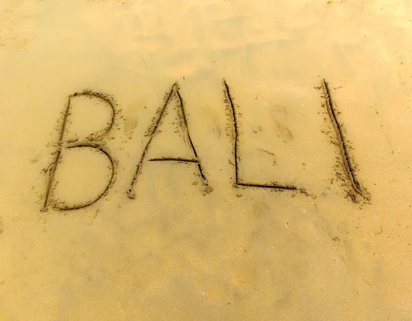 Inschrift auf dem Sandbali. — Stockfoto