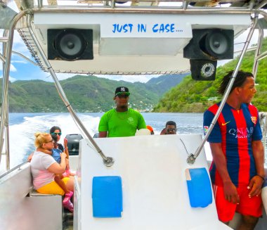 Saint Lucia, Caribbean - May 12, 2016: Catamaran near a beautiful caribbean beach clipart