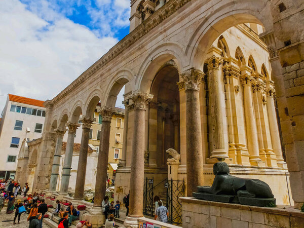 Split, Croatia - May 08, 2014: Tourists walk in the Old City on a cloudy summer day